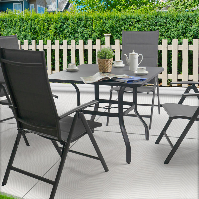 Outdoor Patio Dining Set
A square gray metal patio table with an umbrella hole, surrounded by four black folding chairs, set with a potted plant, teapot, cups, and a magazine, placed on a patio with greenery and a white picket fence in the background. Keywords: outdoor patio table, folding chairs, patio dining set