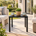 Kozyard black outdoor side table for patio, balcony, porch and garden seating areas, featuring a compact square slatted metal tabletop, sturdy four-leg construction and modern minimalist design. This weather-resistant patio end table is ideal beside outdoor sofas and chairs for holding coffee, drinks, plants, books and décor in small outdoor spaces.