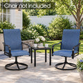 Kozyard black patio side table displayed between two outdoor swivel chairs in a landscaped backyard seating area. Compact square metal end table with slatted tabletop provides convenient space for coffee mugs, flowers, books and décor. Ideal for patios, gardens, porches and decks; chairs shown are not included with the Kozyard outdoor side table.