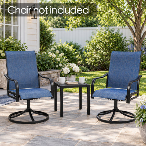 Kozyard black patio side table displayed between two outdoor swivel chairs in a landscaped backyard seating area. Compact square metal end table with slatted tabletop provides convenient space for coffee mugs, flowers, books and décor. Ideal for patios, gardens, porches and decks; chairs shown are not included with the Kozyard outdoor side table.