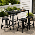 Kozyard 5-Piece Outdoor Bar Set with High-Top Metal Table and 4 matching black barstools. Elegant patio dining set setup on a backyard terrace with wine, wineglasses, and snacks. Sleek, space-saving pub furniture set for outdoor entertainment.