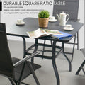 A square outdoor patio table in sleek gray metal, accompanied by matching folding chairs. The table is set with a small potted plant, a tea set, and an open magazine, creating a cozy outdoor - dining or relaxing atmosphere. The text "DURABLE SQUARE PATIO TABLE" highlights the table's durability and stylish design.Durable and Stylish Outdoor Patio Table and Chair Set.outdoor patio table, folding chairs, durable patio furniture, gray metal table, outdoor dining set.