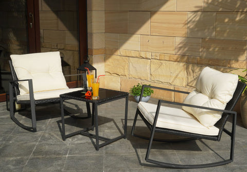 Relaxing Outdoor Rocking Chair Set
alt text：A serene outdoor setup with two rocking chairs featuring white cushions, a small black table with refreshing drinks, set against a stone wall with greenery. Ideal for outdoor relaxation. Keywords: outdoor rocking chairs, patio set, stone wall decor