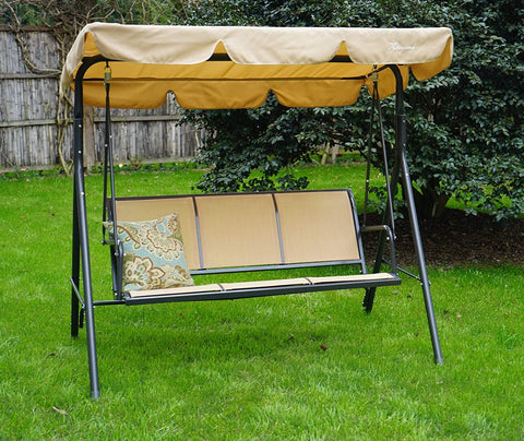 A beige - colored outdoor swing chair set on a lush green lawn. The swing features a canopy of the same beige hue, providing shade. The seating area is composed of beige fabric panels, and a decorative patterned pillow adds a touch of style. The chair has a sturdy black metal frame, making it a cozy spot for relaxation in the garden.Beige Outdoor Swing Chair for Garden Relaxation. Beige Outdoor Swing Chair for Garden Relaxation