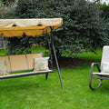 A beige - colored outdoor swing chair with a matching canopy is set on a lush green lawn, accompanied by a gray - hued rocking chair with patterned cushions. The swing chair, featuring the brand "Kozyard," provides a cozy spot for relaxation in a garden setting, surrounded by greenery and a wooden fence in the background.Beige Kozyard Swing Chair: A Relaxing Outdoor Retreat.beige swing chair, Kozyard swing, outdoor seating, garden swing, rocking chair