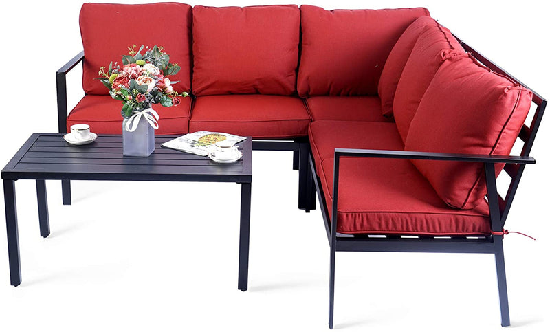 A set of outdoor sectional sofas with vibrant red cushions paired with a black slatted coffee table. The table is adorned with a vase of flowers, cups, and a magazine, creating an inviting outdoor lounging atmosphere. Stylish Red - Cushioned Outdoor Sofa Set with Coffee Table. outdoor sofa set, red cushions, black coffee table, outdoor lounging furniture, patio seating.