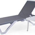 A modern outdoor lounge set featuring a sleek, adjustable lounge bed with a gray fabric surface and a matching white - framed side table. The lounge bed has a contemporary design with angular white legs, and the side table provides a convenient surface for placing items. Contemporary Outdoor Lounge Bed with Side Table. outdoor lounge bed, side table, adjustable backrest, gray fabric, modern design