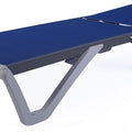 A modern outdoor lounge bed with a sleek design. It has a flat, blue - colored surface and is supported by a white, angular frame. The adjustable backrest mechanism is visible at the rear. Sleek Modern Outdoor Lounge Bed. outdoor lounge bed, modern design, adjustable backrest, blue surface, white frame.