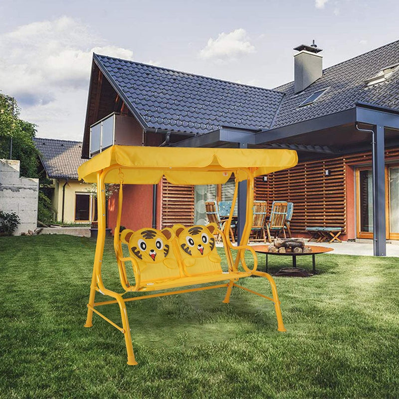 A cheerful yellow outdoor children's swing chair with adorable tiger - face patterns on the seats is set on a lush green lawn in front of a modern house. The swing chair features a matching yellow canopy, providing shade for young users.Sunny Yellow Outdoor Kids' Swing Chair with Tiger Designs. outdoor children's swing chair, yellow swing chair, tiger - face patterns, kids' outdoor furniture.