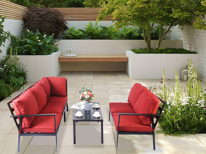 An outdoor seating arrangement featuring a set of modern sofas with red cushions and black metal frames, paired with a black coffee table. The setup is placed on a tiled patio surrounded by lush greenery, with a wooden bench and a small tree in the background, creating a serene and inviting outdoor lounge space.
Serene Outdoor Sofa Set for Relaxing Patio Spaces – Red Cushions.
outdoor sofa set, red-cushioned sofas, black metal frame, patio furniture, outdoor lounge area

