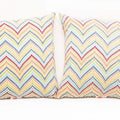Pair of Chevron - Patterned Outdoor Pillows
alt text：Two vibrant outdoor pillows with a chevron pattern in a mix of colors, perfect for enhancing patio seating. Keywords: outdoor pillows, chevron pattern, colorful decor
