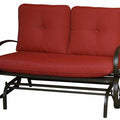 A glider chair with a red cushioned seat and backrest. The chair features a sturdy metal frame with curved armrests and a slatted lower frame, designed for comfortable outdoor or indoor relaxation. glider chair, red cushion, metal frame, curved armrests, relaxation.