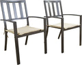 Two outdoor dining chairs with a dark brown metal frame and beige cushioned seats are displayed. The chairs feature a slatted - back design and curved armrests, combining style and comfort for outdoor dining setups. Outdoor Dining Chairs with Cushioned Seats and Slatted Back. outdoor dining chairs, dark brown metal frame, beige cushioned seats, slatted - back chairs, patio furniture.