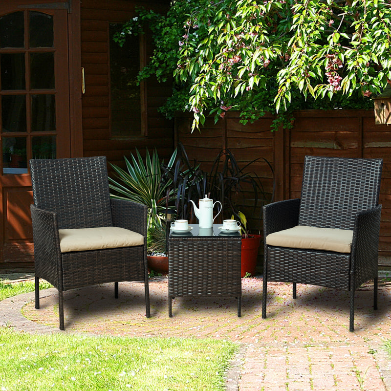 Cozy Outdoor Wicker Seating Set in Garden
alt text：A charming outdoor wicker seating set with two chairs and a small table, placed on a paved area in a garden - like setting, complete with cushions, a teapot, and cups. Keywords: outdoor wicker seating, garden setting, patio furniture