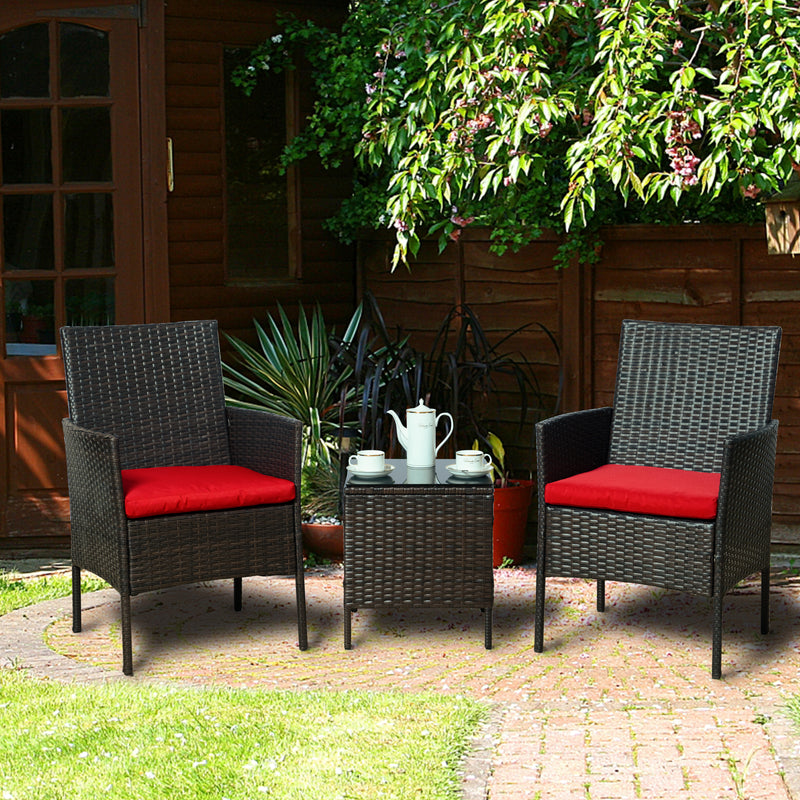 Vibrant Outdoor Wicker Seating Set in Garden
alt text：A charming outdoor wicker seating set with two chairs featuring red cushions and a small table, placed in a garden - like setting with a teapot and cups on the table. Keywords: outdoor wicker seating, red cushions, garden setting
