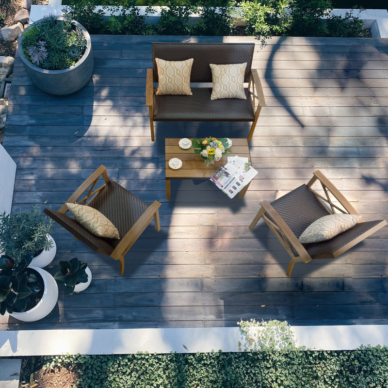 Elegant Outdoor Patio Furniture Set on Wooden Deck
alt text：An overhead view of a stylish outdoor patio furniture set, including a loveseat and two chairs with decorative cushions, a wooden coffee table with a floral centerpiece and cups, set on a wooden deck surrounded by potted plants. Keywords: outdoor patio furniture, wooden deck, decorative cushions
