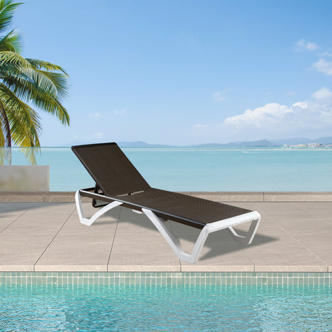 A stylish outdoor lounge bed with a dark brown woven surface and white - colored frame is positioned by a swimming pool, with a scenic view of the sea and palm trees in the background.Stylish Outdoor Lounge Bed by the Poolside. outdoor lounge bed, poolside furniture, woven surface, white frame, seaside view