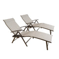 Two beige foldable lounge chairs with a modern design. Each chair features a light - colored fabric surface and dark - colored metal frames, along with a built - in cup holder on the side for added convenience during outdoor relaxation.Beige Foldable Lounge Chairs with Cup Holders. beige foldable lounge chairs, outdoor lounge chairs, light - colored fabric, dark - metal frame, cup holder.