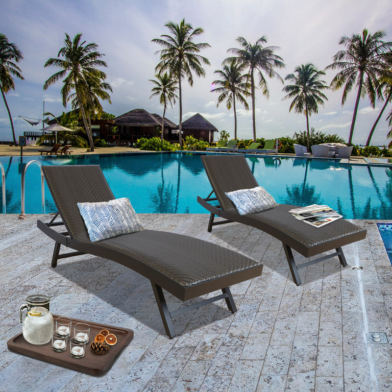 Exquisite Poolside Lounge Chair Set
alt text：A pair of brown lounge chairs with patterned pillows by the pool, complemented by a tray with refreshments, set against a tropical backdrop. Keywords: poolside lounge chairs, tropical setting, outdoor relaxation