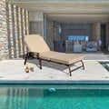 Comfortable Outdoor Lounge Chair by the Pool
alt text：A beige cushioned outdoor lounge chair positioned by a pool, with a bottle of beer and a glass of beer beside it, and a modern indoor living space visible in the background. Keywords: outdoor lounge chair, poolside, modern living space

