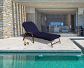 Elegant Navy Blue Outdoor Lounge Chair
alt text：A navy blue outdoor lounge chair placed by a pool, with a bottle and glass of beer beside it, and a modern indoor living space in the background. Keywords: outdoor lounge chair, navy blue, poolside
