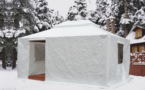 Title: Winter Gazebo Cover in Snowy Forest - Durable Outdoor Protection
Alt Text: White winter gazebo cover set up in a snowy forest, protecting against harsh weather with rolled-up window flaps.
Keywords: winter gazebo cover, snowy forest gazebo, outdoor winter protection, durable gazebo cover, winter camping shelter, snow-resistant gazebo, outdoor gazebo accessories