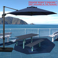 Navy blue cantilever patio umbrella providing shade over a picnic table by the seaside. Note: Counter weight is required and not included in the package. Outdoor offset umbrella in a coastal setting. It shades an outdoor table, and a counter weight is needed but not part of the package. Seaside Patio Umbrella: Counter Weight Not Included. Cantilever Umbrella for Outdoor Use: Counter Weight Required. cantilever umbrella, patio umbrella, outdoor umbrella, counter weight, umbrella shade