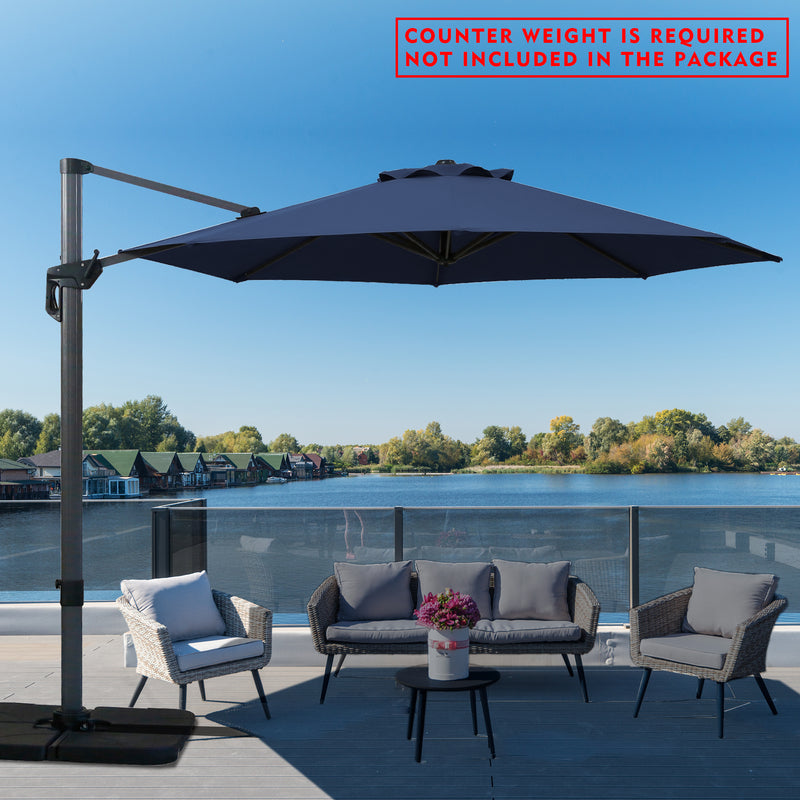 A navy blue cantilever patio umbrella set up on a wooden deck overlooking the lake. Note: Counter weight is required and not included in the package.
Outdoor offset umbrella providing shade near wicker chairs by the lake side. Counter weight needed, not part of the package. Lake side Cantilever Umbrella: Counter Weight Not Included. Ocean - View Patio Umbrella: Counter Weight Required. cantilever umbrella, patio umbrella, outdoor umbrella, seaside umbrella, counter weight, wicker chairs, lake - view