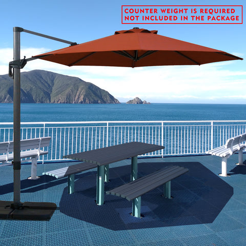 Red cantilever patio umbrella providing shade over a picnic table by the seaside. Note: Counter weight is required and not included in the package. Outdoor offset umbrella in a coastal setting. It shades an outdoor table, and a counter weight is needed but not part of the package. Seaside Patio Umbrella: Counter Weight Not Included. Cantilever Umbrella for Outdoor Use: Counter Weight Required. cantilever umbrella, patio umbrella, outdoor umbrella, counter weight, umbrella shade