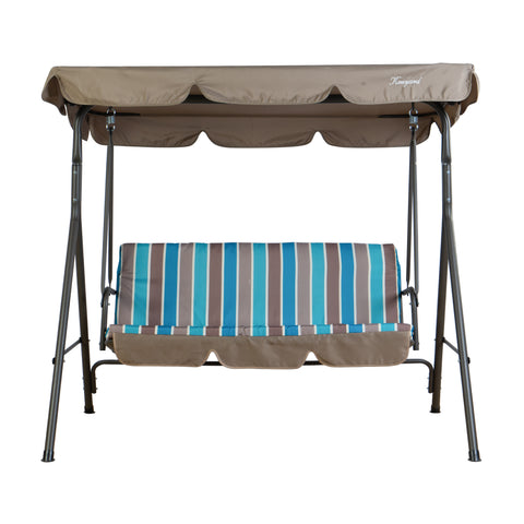 A Kozyard outdoor swing chair with a robust metal frame. It has a brown canopy providing shade, and the seat is covered with a vibrant cushion featuring blue, turquoise, and brown stripes. There is also a matching brown footrest area. Kozyard Outdoor Swing Chair: Comfort and Style for Your Patio. Kozyard swing chair, outdoor patio swing, striped - cushion swing, swing with canopy, comfortable outdoor seating