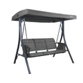 A gray-colored outdoor swing chair by Kozyard. The swing features a sturdy black metal frame, a canopy for shade, and a three-seater bench with gray fabric. It's a comfortable and stylish piece of outdoor furniture ideal for relaxation. Kozyard Gray Outdoor Swing Chair for Relaxing.
 Kozyard swing chair, outdoor swing, gray swing, black metal frame, outdoor relaxation