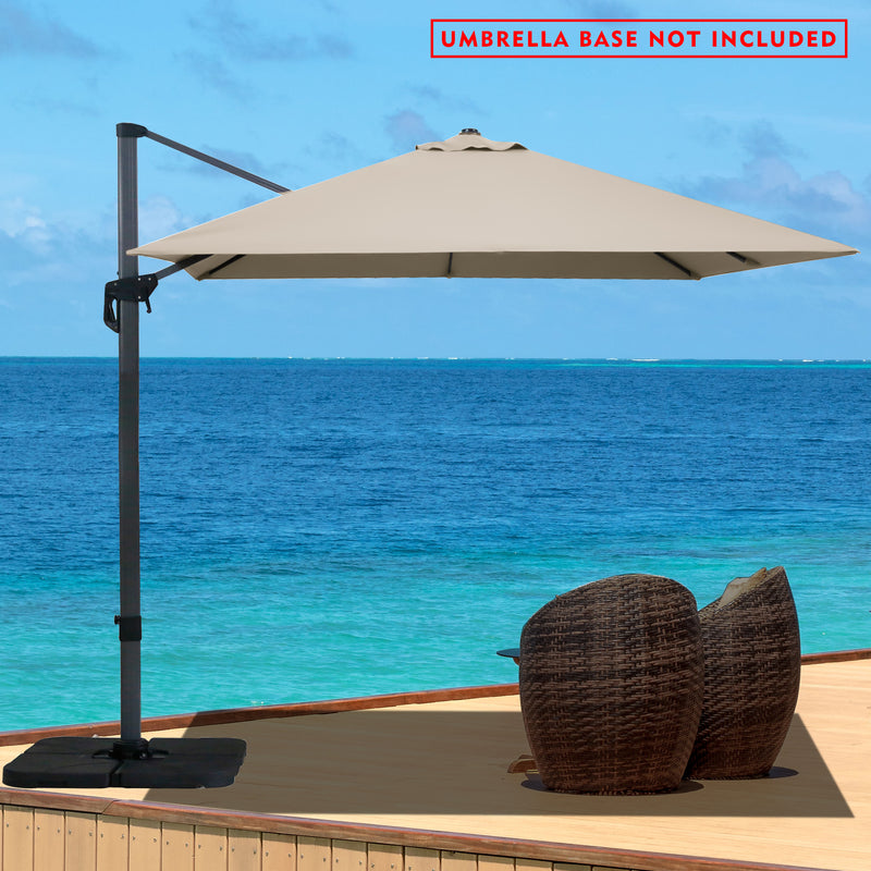 Title: Beachside Wicker Seating with Beige Cantilever Umbrella - Base Not Included
Alt Text: Beachside wicker seating area with a beige cantilever umbrella (base not included), overlooking a turquoise ocean.
Keywords: beachside wicker seating, beige cantilever umbrella, oceanfront patio, outdoor shade, wicker patio furniture, seaside decor, garden umbrella
