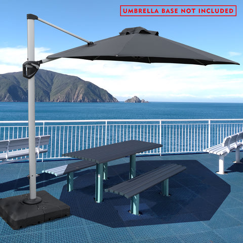 A stylish outdoor offset umbrella in gray provides shade over a picnic table on a deck with a stunning ocean and mountain backdrop. The umbrella is mounted on a base, but a notice in red text states "UMBRELLA BASE NOT INCLUDED". The deck has additional white benches, and the overall setting is bright and inviting.
Gray Cantilever Patio Umbrella: Scenic Outdoor Shade, Base Not Included
Outdoor Offset Umbrella: Enjoy the View, Base Not Included.
cantilever patio umbrella, offset umbrella, gray umbrella
