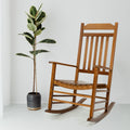 Brown Wooden Rocking Chair with Potted Plant
A brown wooden rocking chair with a classic design, placed beside a potted plant with large, variegated leaves. Ideal for creating a cozy and stylish indoor or outdoor seating area.