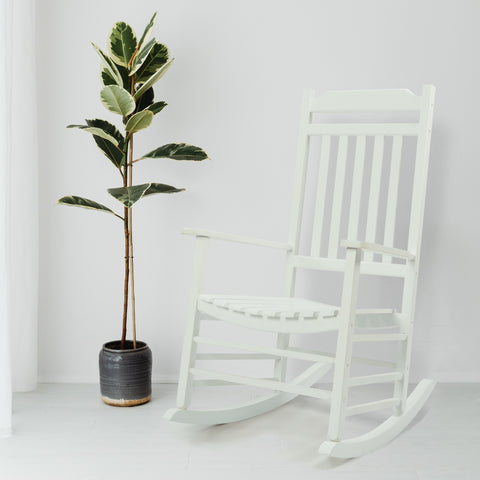 White Wooden Rocking Chair with Potted Plant
A white wooden rocking chair with a classic design, positioned next to a potted plant with large, variegated leaves. Ideal for creating a serene and stylish indoor or outdoor seating area.
