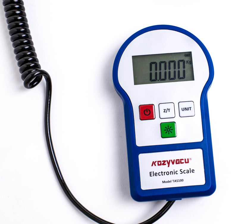 Title: Kozyvacu Electronic Scale TAS100 for HVAC Refrigerant Charging
Alt Text: Kozyvacu TAS100 Electronic Scale with digital display and coiled cable, ideal for HVAC refrigerant charging and weighing.
Keywords: Kozyvacu, TAS100, electronic scale, HVAC, refrigerant charging, digital scale, weighing tool