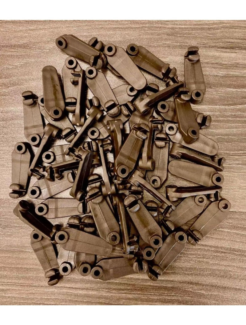 Bulk Brown Plastic Hooks for gazebo curtain– Durable Hardware for Fence and Gate Latches. A large pile of brown plastic hooks, designed for fencing, gates, and latch systems. Weather-resistant and durable for outdoor use.
