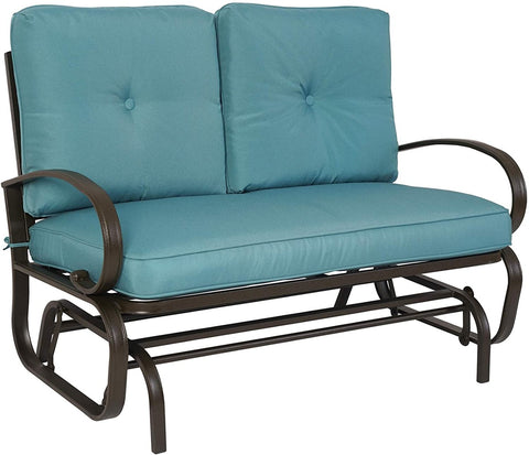 A glider chair with a blue cushioned seat and backrest. The chair features a sturdy metal frame with curved armrests and a slatted lower frame, designed for comfortable outdoor or indoor relaxation. glider chair, blue cushion, metal frame, curved armrests, relaxation.