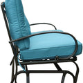 Side view of a glider chair with a blue cushioned seat and backrest. The chair features a sturdy metal frame with curved armrests and a slatted lower frame, designed for comfortable outdoor or indoor relaxation. glider chair, blue cushion, metal frame, curved armrests, relaxation.