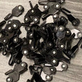 A pile of black hooks with wheels and metal parts, likely used for outdoor gazebo curtains or fixtures. These hooks appear to be designed for smooth movement along tracks.A pile of black hooks with wheels and metal parts, likely used for outdoor gazebo curtains or fixtures. These hooks appear to be designed for smooth movement along tracks. A pile of black hooks with wheels and metal parts, likely used for outdoor gazebo curtains or fixtures. These hooks appear to be designed for smooth movement along track