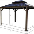 A technical illustration of a 10' x 12' outdoor gazebo with a dark - colored metal roof and wooden - toned frame. Red dotted lines and measurements indicate the dimensions of the gazebo: height of 9.6 feet, interior height of 6.5 feet, and various base lengths including 10.5 feet, 11.2 feet, 8.3 feet, 9.1 feet, 12 feet, and 10 feet.10' x 12' Outdoor Gazebo: Precise Dimensions. outdoor gazebo, 10x12 gazebo, gazebo dimensions, metal roof, wooden frame.