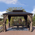 A charming outdoor gazebo with a dark brown metal roof and wooden - toned frame stands on a wooden deck. Beige curtains are tied back around the gazebo, which houses an outdoor dining setup with a table, chairs, and a decorative blue - and - white rug. The background features lush greenery and a clear blue sky with scattered clouds. Inviting Outdoor Gazebo for Relaxation and Dining. outdoor gazebo, metal roof, wooden frame, beige curtains, outdoor dining area.