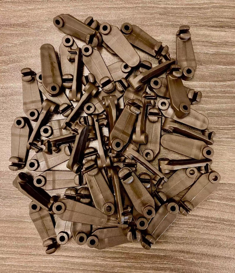 Bulk Brown Plastic Hooks for gazebo curtain– Durable Hardware for Fence and Gate Latches. A large pile of brown plastic hooks, designed for fencing, gates, and latch systems. Weather-resistant and durable for outdoor use.