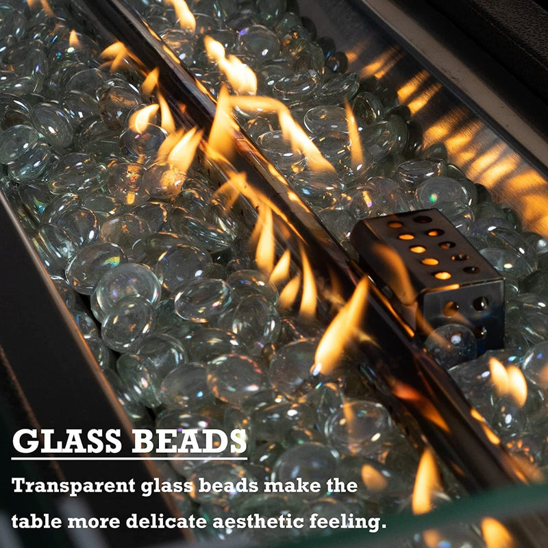 A close - up view of a fire pit table filled with transparent glass beads, through which flames are flickering. The text "GLASS BEADS" and "Transparent glass beads make the table more delicate aesthetic feeling" emphasizes the aesthetic appeal of the glass beads in the fire pit.Fire Pit Table with Aesthetic Glass Beads.fire pit table, glass beads, transparent fire pit decor, aesthetic patio furniture, outdoor fire feature
