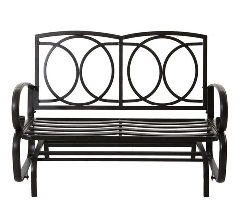 A black metal glider bench without cushions. It features an elegant design with circular patterns on the backrest, curved armrests, and horizontal slats on the seat, providing a sturdy and stylish seating option for outdoor spaces. Black Metal Glider Bench – Cushion - Free Design. black metal glider bench, cushion - free, circular backrest design, curved armrests, outdoor seating.